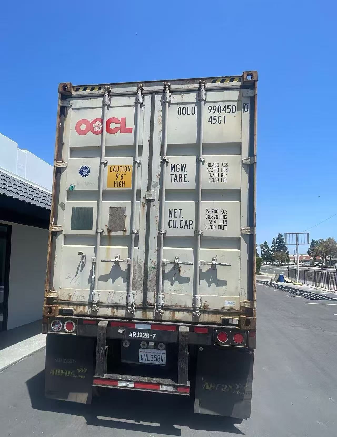 Rear doors of an OOCL import container on chassis