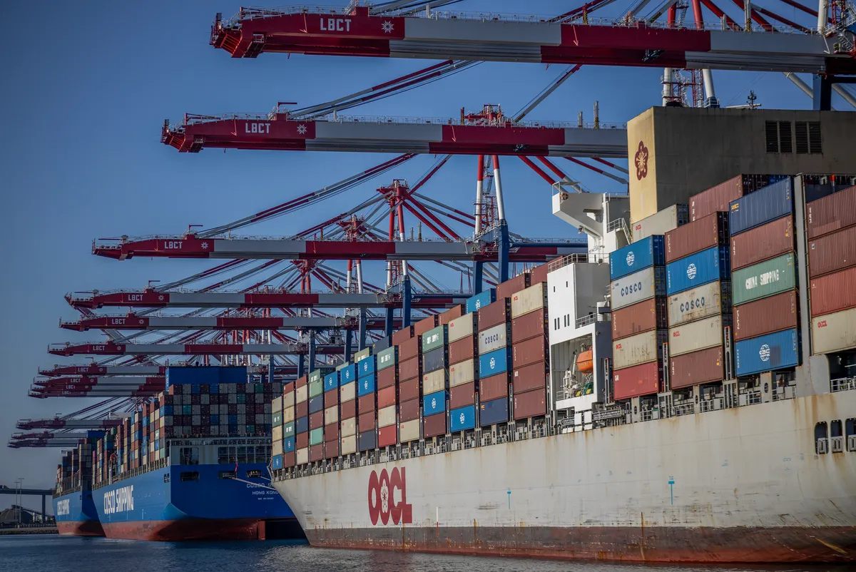 Container vessel alongside port cranes at Long Beach terminal